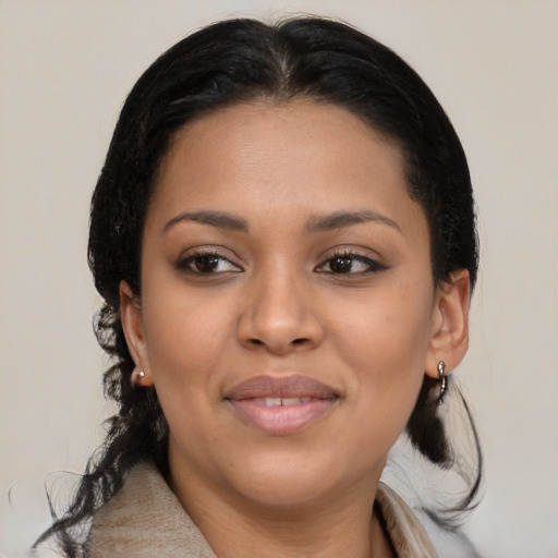 Joyful black young-adult female with medium  black hair and brown eyes