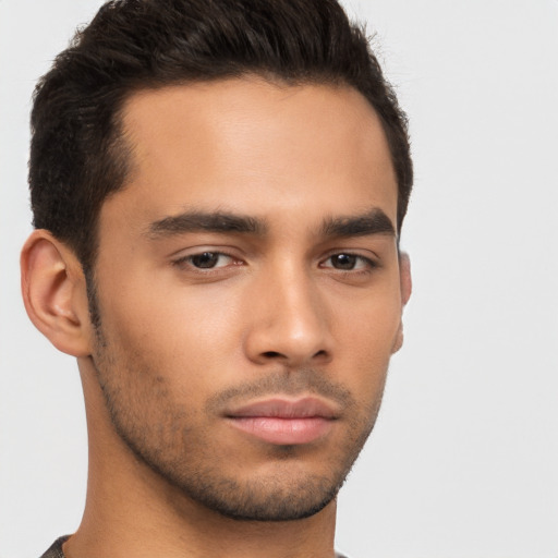 Neutral latino young-adult male with short  brown hair and brown eyes