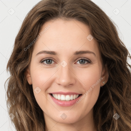 Joyful white young-adult female with long  brown hair and green eyes