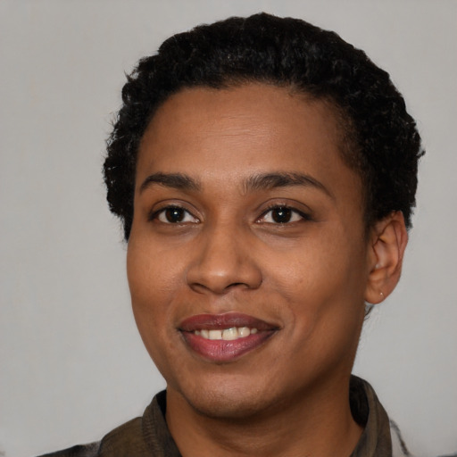 Joyful latino young-adult female with short  black hair and brown eyes