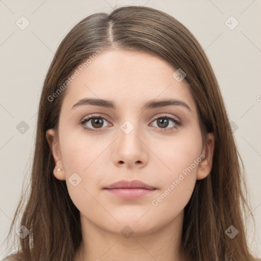 Neutral white young-adult female with long  brown hair and brown eyes