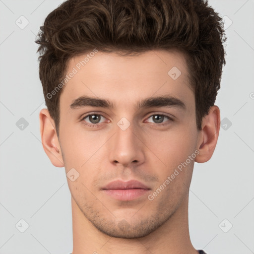 Neutral white young-adult male with short  brown hair and brown eyes