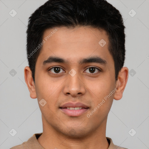 Joyful latino young-adult male with short  black hair and brown eyes