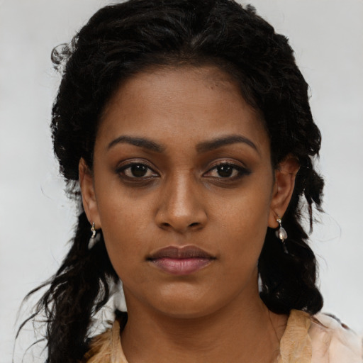 Neutral black young-adult female with medium  black hair and brown eyes