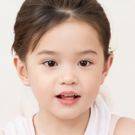 Joyful white child female with short  brown hair and brown eyes