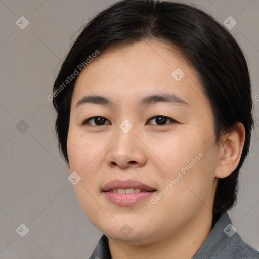 Joyful asian young-adult female with medium  brown hair and brown eyes