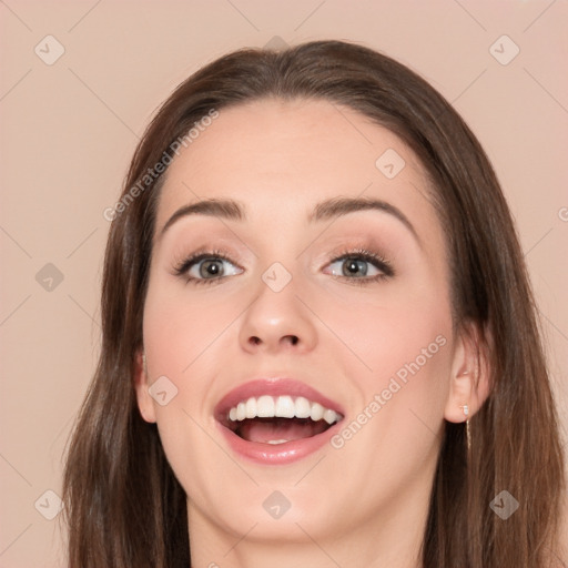 Joyful white young-adult female with long  brown hair and brown eyes