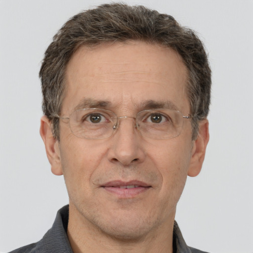 Joyful white middle-aged male with short  brown hair and brown eyes