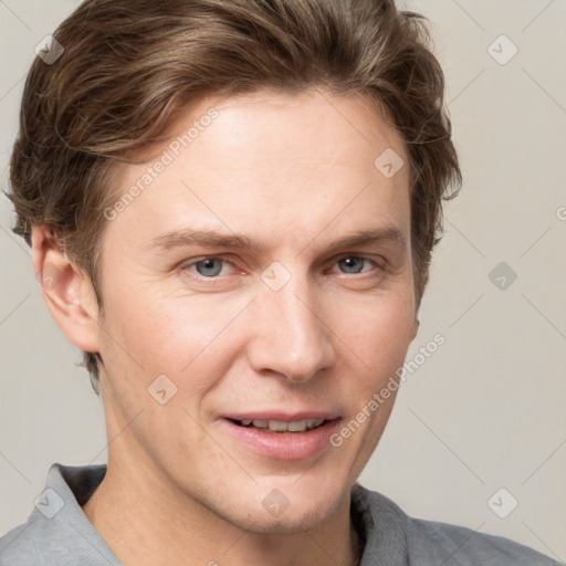 Joyful white adult male with short  brown hair and grey eyes