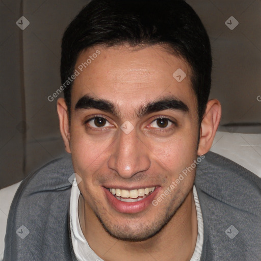 Joyful white young-adult male with short  black hair and brown eyes