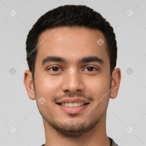 Joyful latino young-adult male with short  brown hair and brown eyes