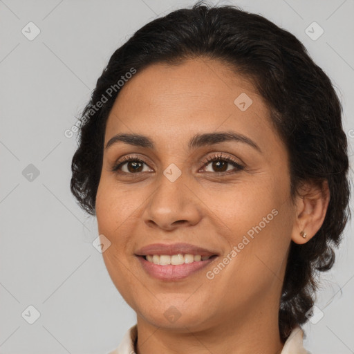 Joyful latino young-adult female with medium  brown hair and brown eyes