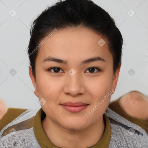 Joyful asian young-adult female with short  black hair and brown eyes