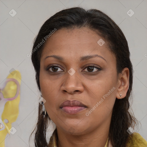 Joyful white adult female with medium  brown hair and brown eyes