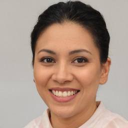 Joyful latino young-adult female with short  brown hair and brown eyes