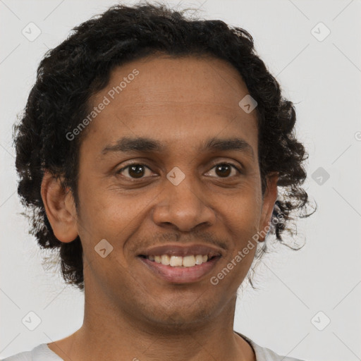 Joyful black young-adult male with short  brown hair and brown eyes