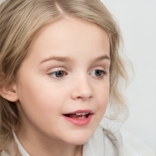 Joyful white child female with medium  brown hair and grey eyes