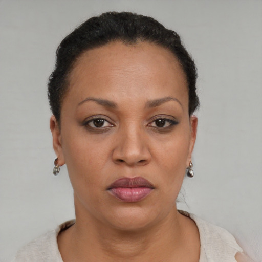 Neutral black young-adult female with short  brown hair and brown eyes