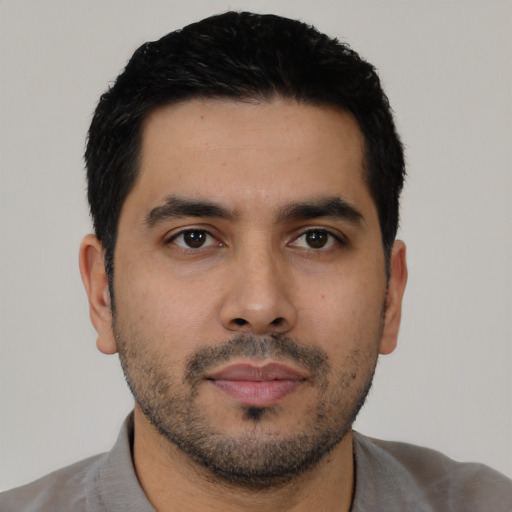 Neutral latino young-adult male with short  black hair and brown eyes