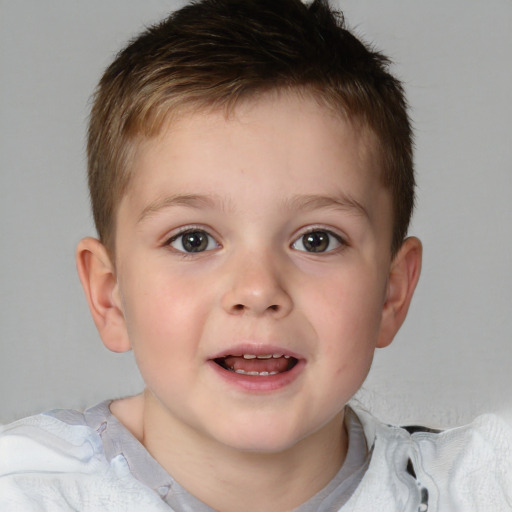 Joyful white child male with short  brown hair and brown eyes