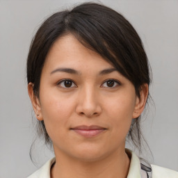 Joyful asian young-adult female with medium  brown hair and brown eyes