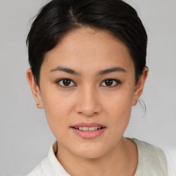 Joyful asian young-adult female with short  brown hair and brown eyes