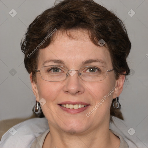 Joyful white adult female with medium  brown hair and blue eyes