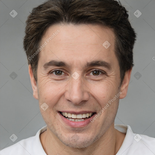 Joyful white adult male with short  brown hair and brown eyes