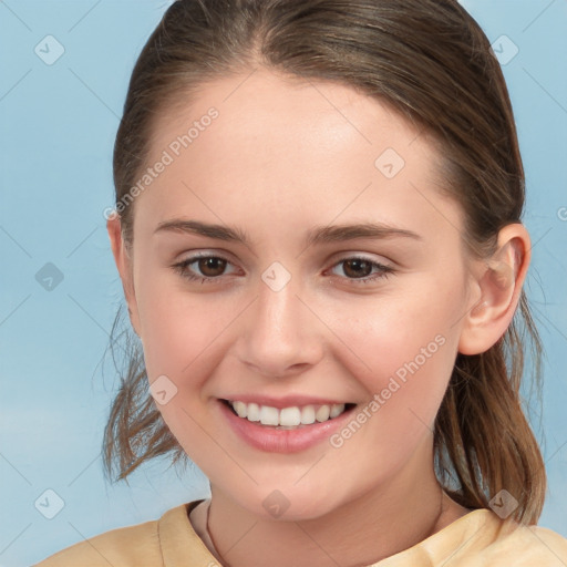 Joyful white child female with medium  brown hair and brown eyes