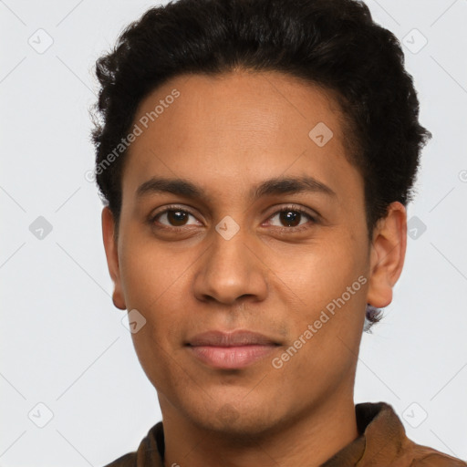 Joyful latino young-adult male with short  brown hair and brown eyes