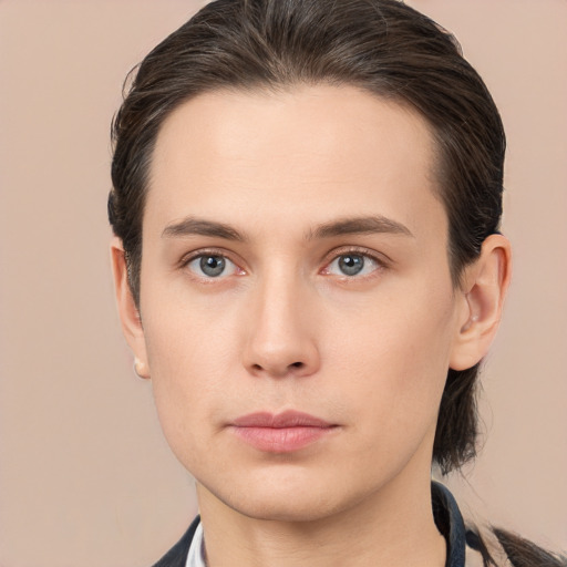 Neutral white young-adult male with long  brown hair and brown eyes