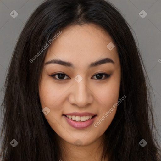 Joyful latino young-adult female with long  brown hair and brown eyes