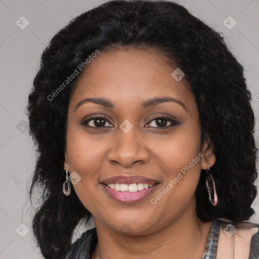 Joyful black young-adult female with long  brown hair and brown eyes