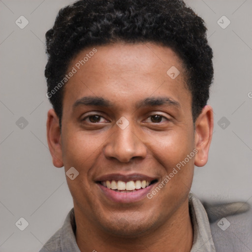 Joyful latino young-adult male with short  brown hair and brown eyes