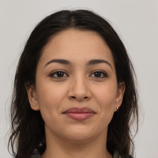 Joyful latino young-adult female with long  brown hair and brown eyes