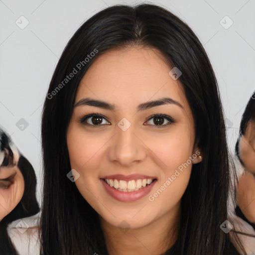 Joyful latino young-adult female with long  black hair and brown eyes