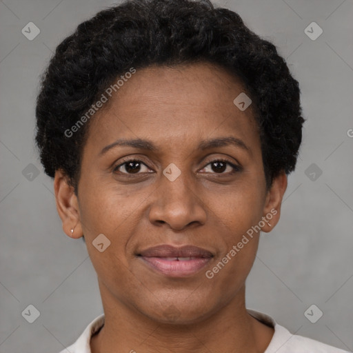 Joyful black adult female with short  brown hair and brown eyes