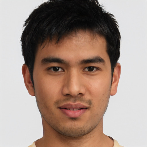 Joyful asian young-adult male with short  brown hair and brown eyes