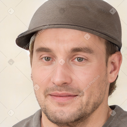 Joyful white adult male with short  brown hair and brown eyes