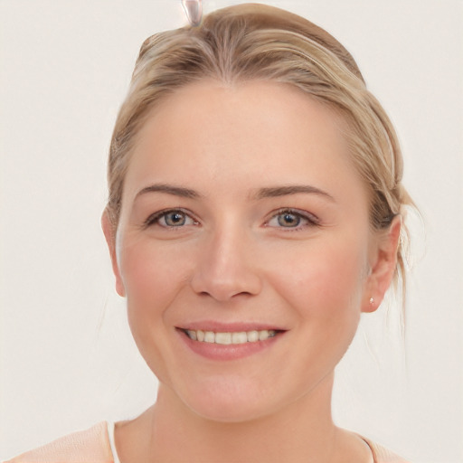 Joyful white young-adult female with medium  brown hair and blue eyes