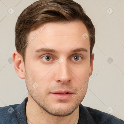 Neutral white young-adult male with short  brown hair and grey eyes