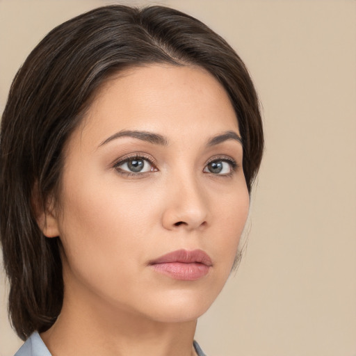 Neutral white young-adult female with medium  brown hair and brown eyes