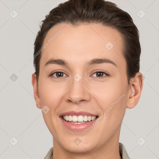 Joyful white young-adult female with short  brown hair and brown eyes