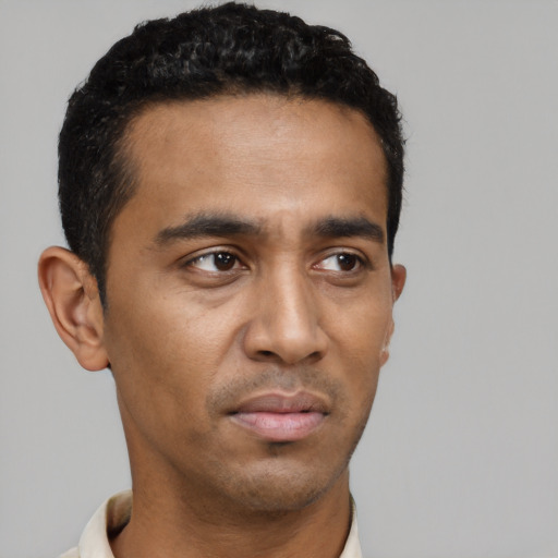 Neutral black young-adult male with short  black hair and brown eyes