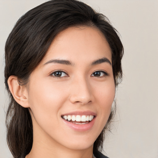 Joyful white young-adult female with medium  brown hair and brown eyes