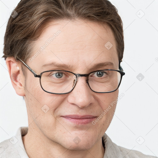 Joyful white adult male with short  brown hair and grey eyes