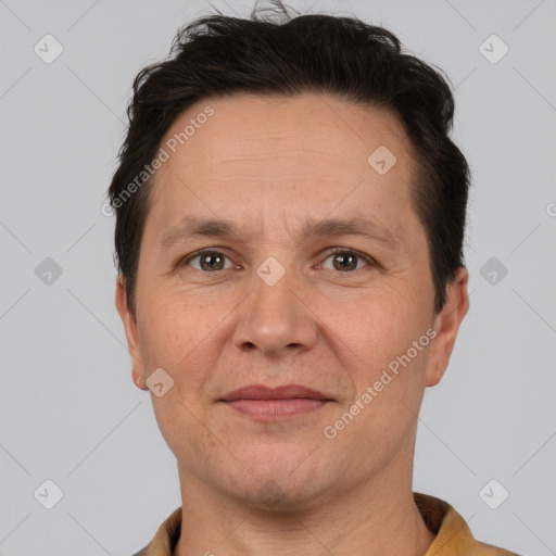 Joyful white adult male with short  brown hair and brown eyes