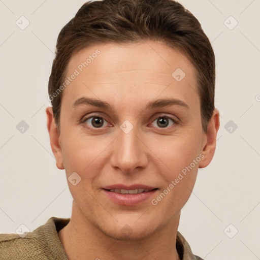 Joyful white young-adult female with short  brown hair and grey eyes