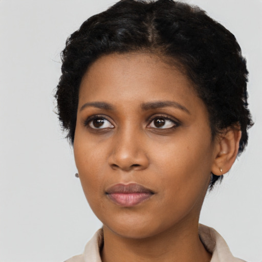 Neutral black young-adult female with short  black hair and brown eyes