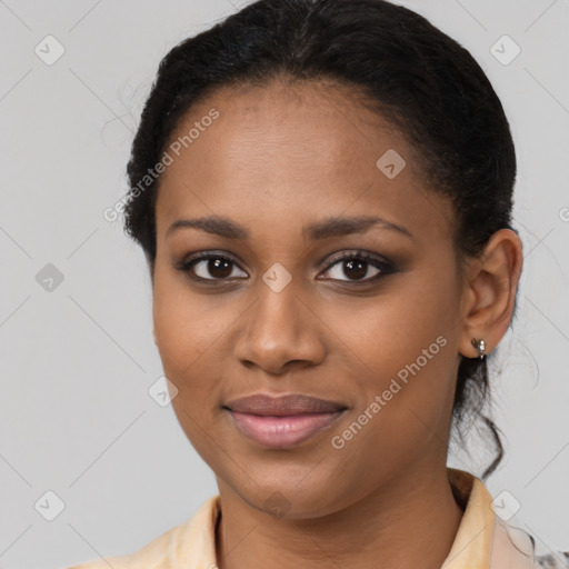 Joyful black young-adult female with medium  brown hair and brown eyes